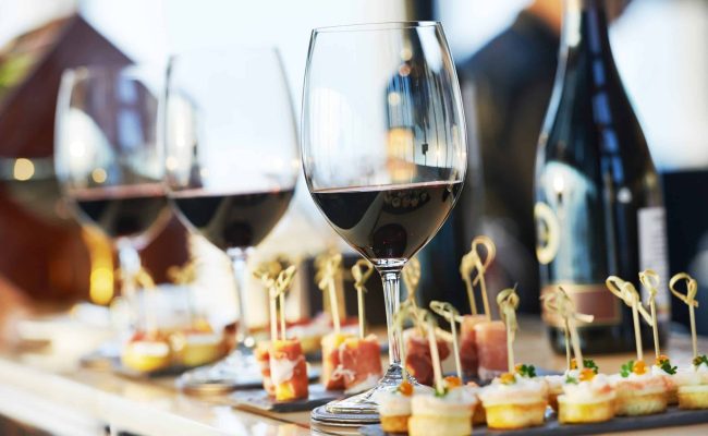 close-up catering table set catering services background with snacks and glasses of wine on bartender counter in restaurant