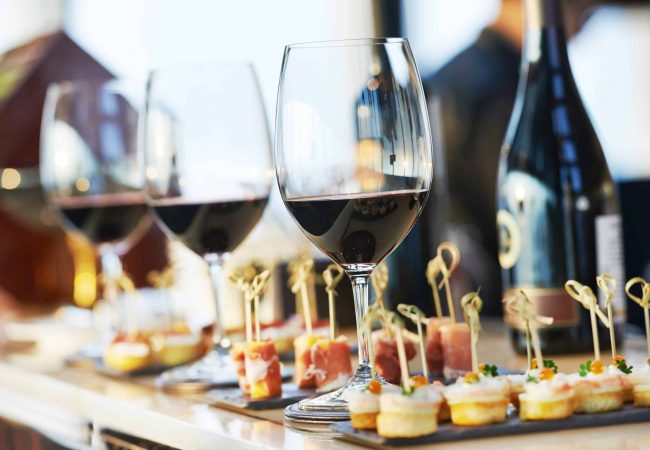 close-up catering table set catering services background with snacks and glasses of wine on bartender counter in restaurant